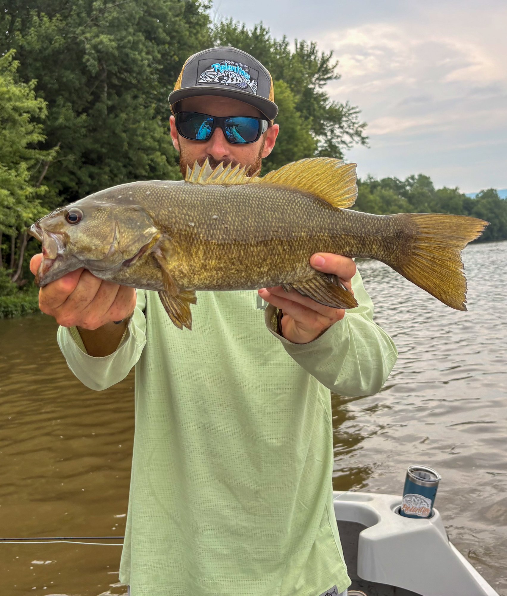 Jake Villwock holds up a nice river smallmouth