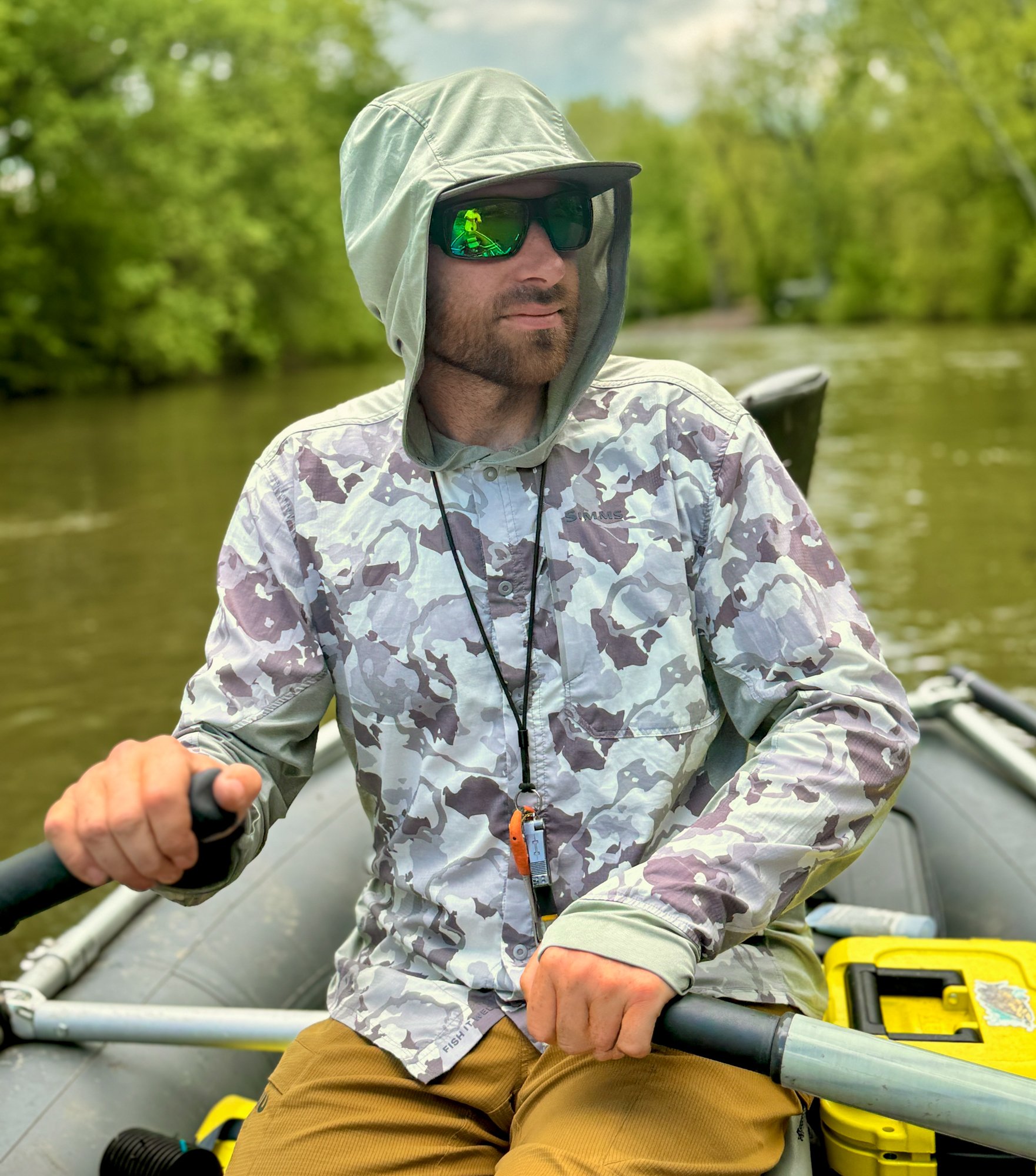 Jake Villwock rows down a river while fishing.