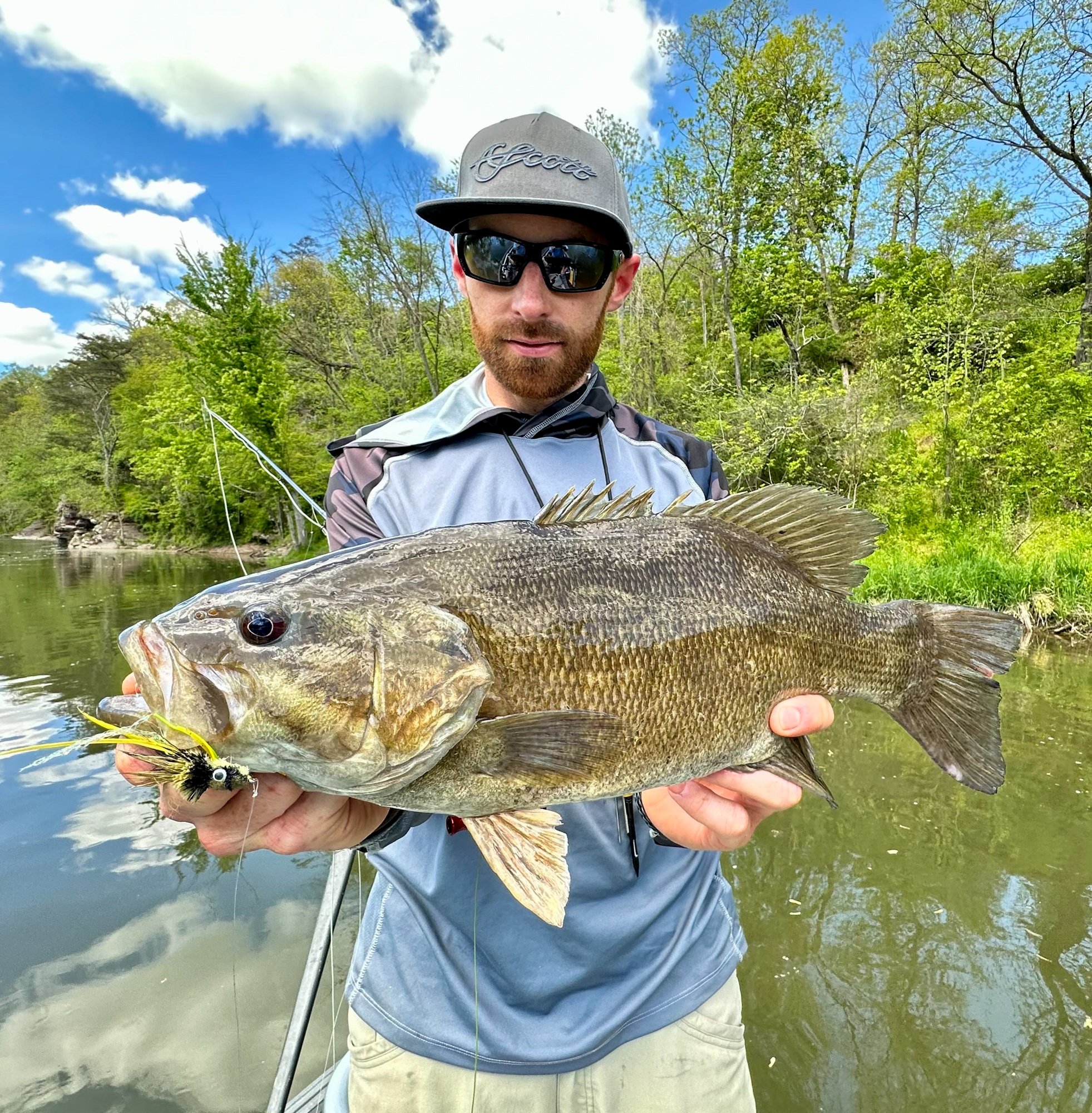 Jake Villwock holds up a nice river smallmouth