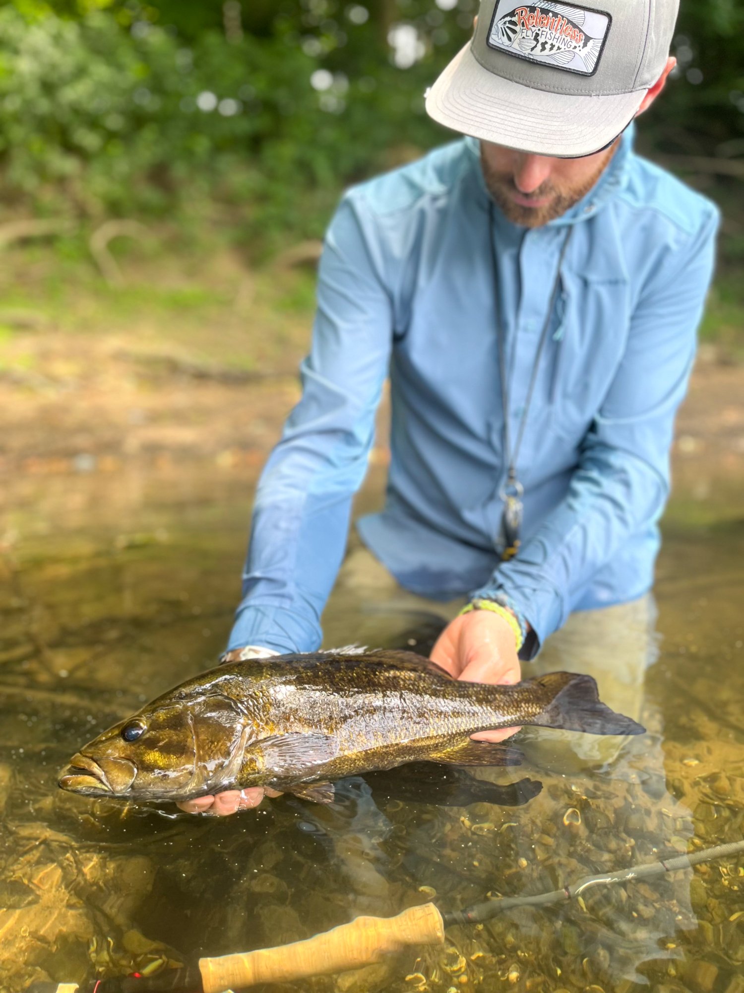Jake Villwock releases a nice river smallmouth caught on the fly