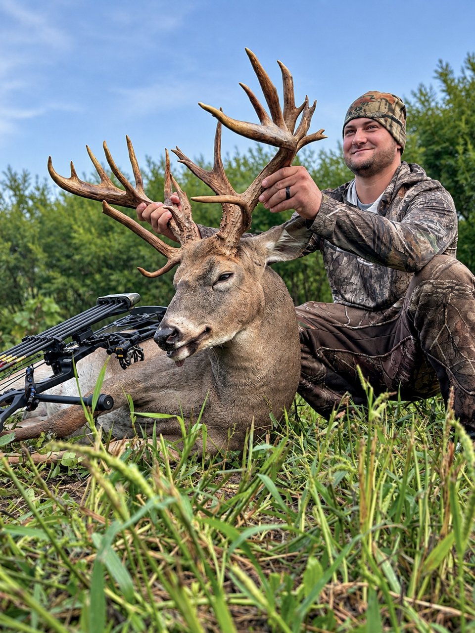 A photo of farmer David Hostetler with a big buck.