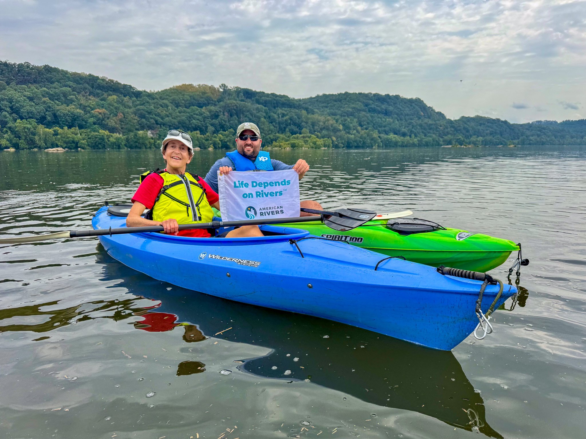 Two kayakers on a river