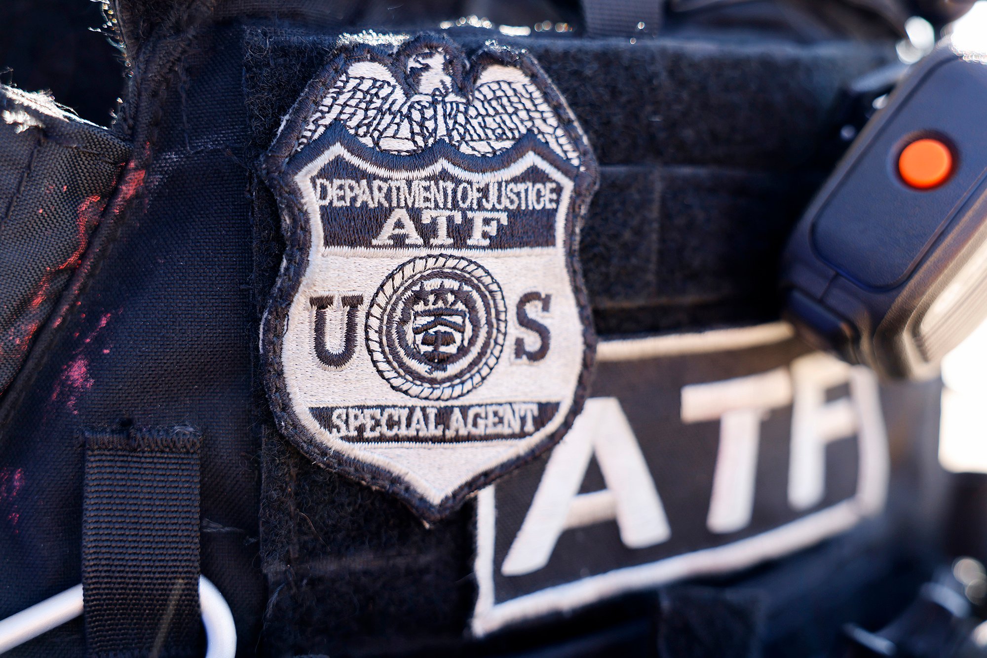 A badge for an ATF/DOJ employee