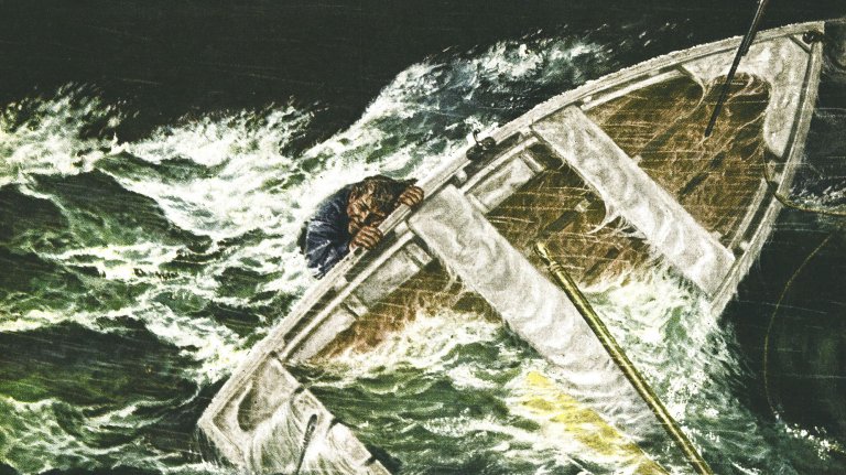 A man holds onto a boat in a flipped hurricane.