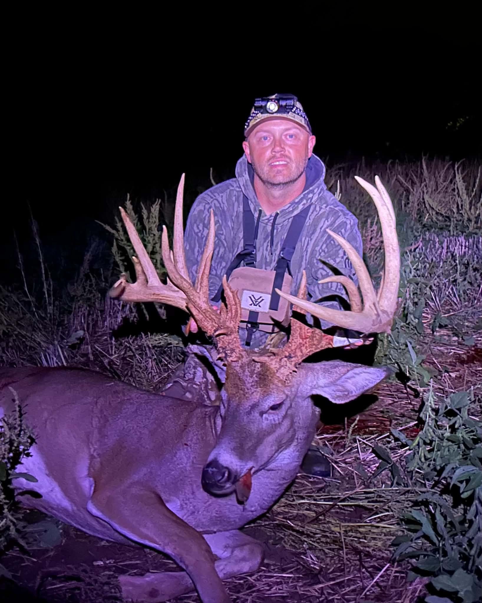 A happy hunter with a big buck.